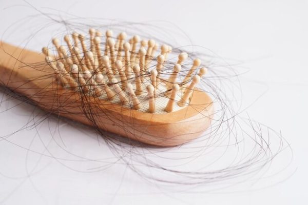 hair-loss-fall-with-comb-brush-isolated-white-background_622428-2227